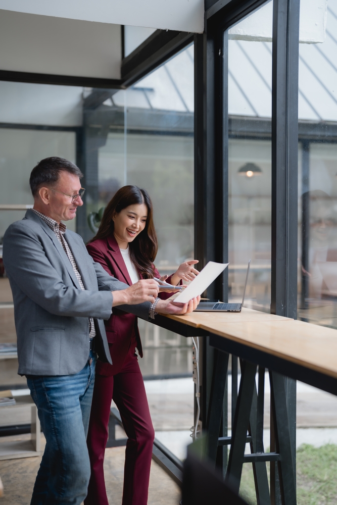 business,partners,reviewing,contract,terms,and,conditions,,negotiating,and,discussing